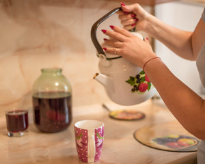 compote is poured from a transparent jar