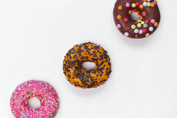 Colorful delicious donuts isolated on white background cutout