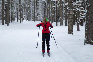 Skiing in the winter forest. Winter leisure and recreation. Cross country Skilling.