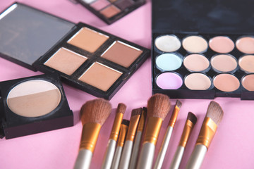 different makeup products and brushes