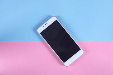 white smart phone on the color table