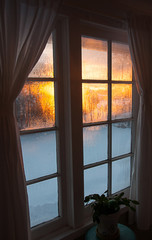 Cold winter sunrise window