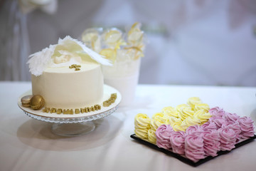 Delicious children's cake. A table with a cake for the birthday of the child. Culinary arts desserts. The art of cooking in sweet dishes.