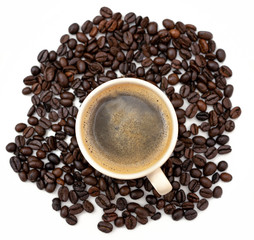 Top view cup of coffee with beans background