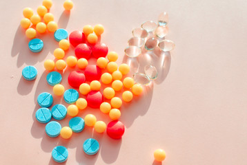 pharmaceutical pills thermometer a pink background. Copy space. the concept of health. concept of life. assorted medicines. bright pills. coronavirus