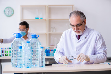 Two chemists working in the lab