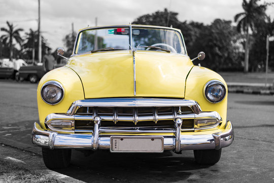 frontview colorkey of old yellow american classic car in havana cuba