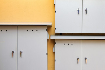 Electrical distribution control boxes on yellow wall, Power supply board, Minimal style.