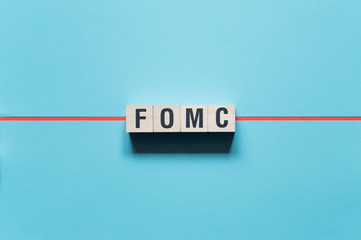 FOMC - Federal Open Market Committee word concept on cubes