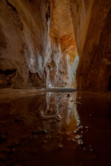 Reflection from a puddle at the bottom of an ancient water reservoir in Zippori Park, Israel