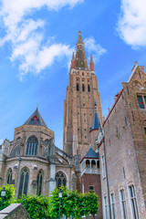 Fototapeta na wymiar Bruges, Belgium, Church of Our Lady under a clear sky. Hero view