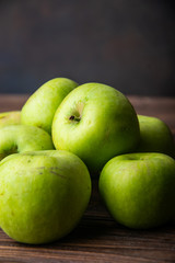 fresh seasonal apples on a wooden table