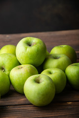 green apples on wooden table