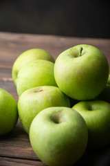 green apples on wooden table
