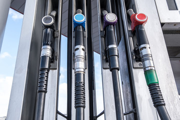 Gas and petrol station. Guns for refueling at a gas station. Detail of a petrol pump different...