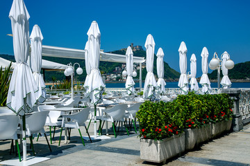 Wonderful cafe near the La Concha beach with view to the Bay of Biscay and Mount Igueldo in San...
