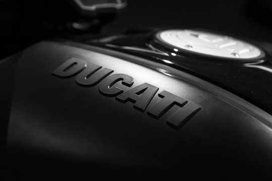 Ducati brand name is on black sports bike tank