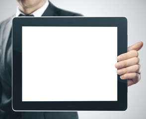 Businessman holding digital touch pad