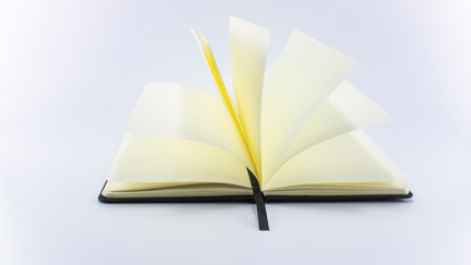 Open book on white background, top view. Space for text. Close up.