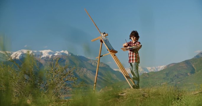 Young boy creating an artpiece, inspired by beauty of lake in mountains, making his dream of becoming artist come true - childhood memories, inspiration 4k