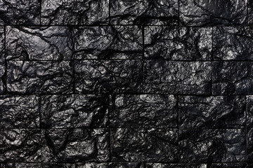Texture and background of decorative tiles in the form of black coal