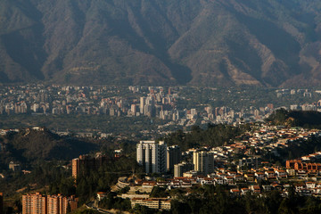 city with mountain in the background