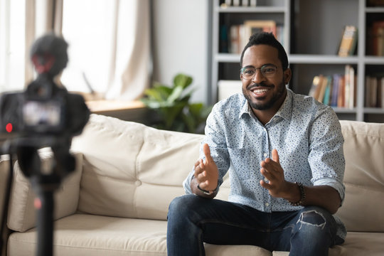 Happy Young African American Man Recording Educational Video Webinar.