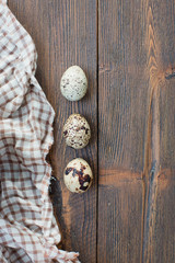 Tree quail eggs on a wooden background