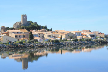 Fototapeta na wymiar The old town of Gruissan in the heart of Regional Natural Park of Narbonne, dominated by its castle, the ruins of the Barberousse tower and its small fishermen's houses, Aude, France