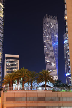 DUBAI, UAE - NOVEMBER 15: The night illumination of Dubai Marina and Cayan Tower on November 15, 2019 in Dubai, UAE