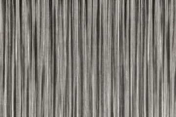 Texture of dark gray wallpaper with abstract vertical lines, background