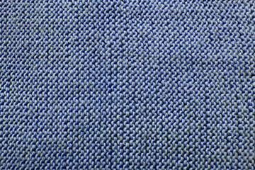 Fototapeta na wymiar blue textured knitted background, large knit