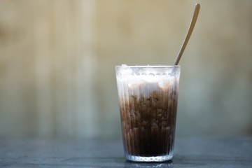 A glass of ice milk chocolate in cafe