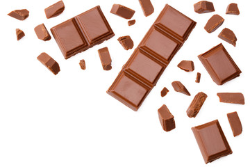 Milk chocolate pieces isolated on white background. top view