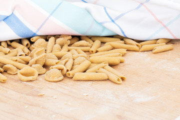 Homemade raw apulian pasta background of italian pasta called Orecchiette and Maccheroni, typical...