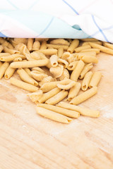 Homemade raw apulian pasta background of italian pasta called Orecchiette and Maccheroni, typical dish of Southern Italy, Puglia, Salento