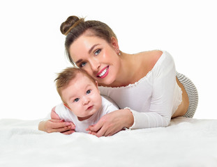 Mother and baby playing and smiling. Happy family.