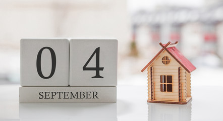 September calendar and toy home. Day 4 of month. Card message for print or remember