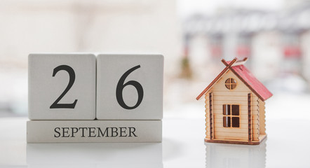 September calendar and toy home. Day 26 of month. Card message for print or remember