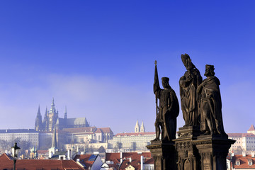 Statues of Saints Norbert, Wenceslaus and Sigismund on Charles Bridge in Prague, Czech Republic. Medieval Gothic bridge, finished in the 15th century, crossing the Vltava River