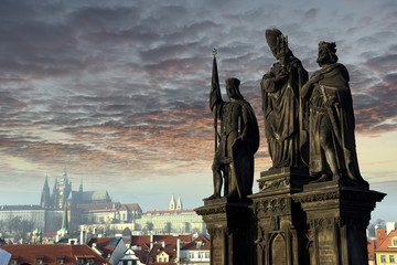 Obraz premium Statues of Saints Norbert, Wenceslaus and Sigismund on Charles Bridge in Prague, Czech Republic. Medieval Gothic bridge, finished in the 15th century, crossing the Vltava River