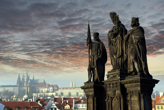 Statues of Saints Norbert, Wenceslaus and Sigismund on Charles Bridge in Prague, Czech Republic. Medieval Gothic bridge, finished in the 15th century, crossing the Vltava River