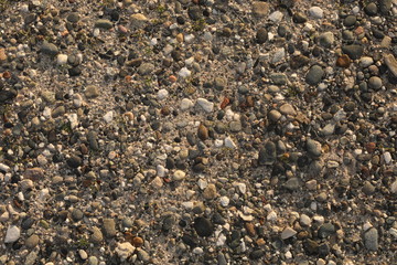 background of pebbles on the beach. Stone gravel texture.stone background or wallpaper. pebble beach outdoor nature