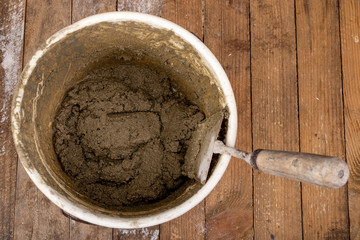 Trowel and mortar prepared for masonry. Accessories for building houses.