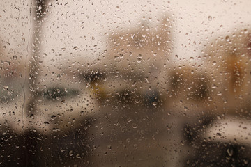 Raindrops on window. drops of water from the rain flow down the glass. Rainfall, Drip, Raining, Droplets of water.