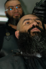 Latin American barber working the style with a long beard in the city of Bogotá.