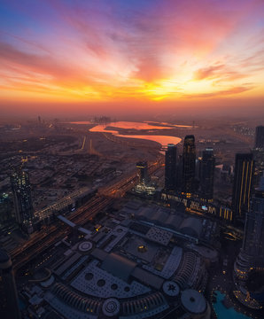 Beautiful sunrise above Dubai skyline, United Arab Emirates, aerial panoramic view from Burj Khalifa. © DedMityay