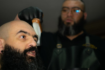 Latin American barber working the style with a long beard in the city of Bogotá.