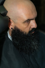 Latin American barber working the style with a long beard in the city of Bogotá.