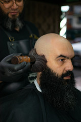 Latin American barber working the style with a long beard in the city of Bogotá.